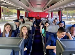 Выпускники университета в салоне автобуса